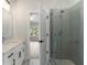 White bathroom showcasing stylish finishes, a glass shower, and a vanity sink at 912 Sunny Meadows Ln, Marietta, GA 30062