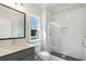 Modern bathroom featuring a glass shower, subway tile, and a sleek vanity with a large mirror at 912 Sunny Meadows Ln, Marietta, GA 30062