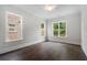 Empty bedroom features hardwood floors and large windows that provide natural light at 912 Sunny Meadows Ln, Marietta, GA 30062