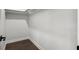 Walk-in closet with dark wood floors and a rod for hanging clothes at 912 Sunny Meadows Ln, Marietta, GA 30062