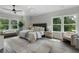 Spacious main bedroom with large windows, tray ceiling, ceiling fan and tree views at 912 Sunny Meadows Ln, Marietta, GA 30062