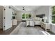 Well-lit main bedroom with a fireplace, plush seating, and view of trees at 912 Sunny Meadows Ln, Marietta, GA 30062