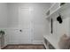 Welcoming mudroom with built-in bench, shelving, and hooks, perfect for organizing outerwear and accessories at 912 Sunny Meadows Ln, Marietta, GA 30062