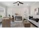 Spacious home office featuring natural light, modern decor, and a comfortable seating area at 912 Sunny Meadows Ln, Marietta, GA 30062