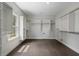 Large walk-in closet with custom shelving and hardwood floors at 912 Sunny Meadows Ln, Marietta, GA 30062