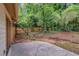 A backyard features a patio, wooden fence, and a stone water feature at 112 Valley Rd, Stockbridge, GA 30281