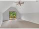 Spacious carpeted bedroom with vaulted ceiling and sliding doors to the deck at 112 Valley Rd, Stockbridge, GA 30281