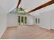 Bright and airy living room with vaulted ceilings and wood beams, complemented by natural light at 112 Valley Rd, Stockbridge, GA 30281