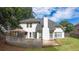Rear view of home featuring a large deck and well-maintained lawn at 1245 Grace Hadaway Ln, Lawrenceville, GA 30043