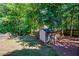 Well-maintained storage shed in a spacious, tree-lined backyard at 1245 Grace Hadaway Ln, Lawrenceville, GA 30043