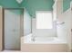 Bright bathroom featuring soaking tub and shower at 1245 Grace Hadaway Ln, Lawrenceville, GA 30043