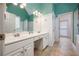 Bright bathroom featuring double vanity, shower, and separate toilet room at 1245 Grace Hadaway Ln, Lawrenceville, GA 30043