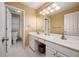 Bright bathroom with double vanity, modern lighting, and a separate toilet room at 1245 Grace Hadaway Ln, Lawrenceville, GA 30043