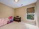 Neutral bedroom with large window, carpet flooring, and standard closet at 1245 Grace Hadaway Ln, Lawrenceville, GA 30043