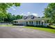Charming white clubhouse with covered porch and manicured lawn in a well-maintained community at 1245 Grace Hadaway Ln, Lawrenceville, GA 30043