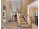 Spacious foyer with a staircase leading to the second floor and views into the living room at 1245 Grace Hadaway Ln, Lawrenceville, GA 30043