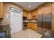 Bright kitchen with stainless steel appliances, granite counters, and ample cabinet space at 1245 Grace Hadaway Ln, Lawrenceville, GA 30043