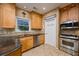 This kitchen features stainless appliances, granite counters, and tile backsplash at 1245 Grace Hadaway Ln, Lawrenceville, GA 30043