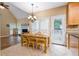 Eat-in kitchen features natural light, stainless appliances, and opens to a back deck at 1245 Grace Hadaway Ln, Lawrenceville, GA 30043
