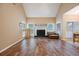 Bright living room with a vaulted ceiling, fireplace, hardwood floors, and large windows at 1245 Grace Hadaway Ln, Lawrenceville, GA 30043