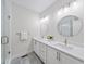 Modern bathroom with double vanity, white countertops, and a glass-enclosed shower at 1247 Zucchini Se Cir, Atlanta, GA 30315