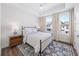 Cozy bedroom with a comfortable bed, neutral decor, and bright windows at 1247 Zucchini Se Cir, Atlanta, GA 30315
