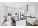 Modern kitchen with stainless steel appliances, white cabinets, dark countertops, and an island at 1247 Zucchini Se Cir, Atlanta, GA 30315