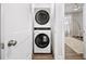 Laundry closet features a stacked washer and dryer at 1247 Zucchini Se Cir, Atlanta, GA 30315