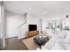 The bright living room has a modern open concept with wood floors and a ceiling fan at 1247 Zucchini Se Cir, Atlanta, GA 30315