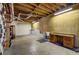 Unfinished basement area featuring a sink and wooden shelving at 3452 Monica Lane Southwest Sw Ln, Conyers, GA 30094