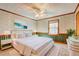 Brightly lit bedroom with plush carpeting, neutral colored walls, wainscotting, and bright natural light at 3452 Monica Lane Southwest Sw Ln, Conyers, GA 30094