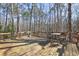 Spacious wooden deck with seating, perfect for enjoying the natural surroundings at 3452 Monica Lane Southwest Sw Ln, Conyers, GA 30094