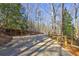 Long paved driveway lined with trees leading up to the property at 3452 Monica Lane Southwest Sw Ln, Conyers, GA 30094