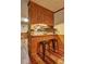 View of kitchen with wood counters, breakfast bar, wood floors and decoratively tiled backsplash at 3452 Monica Lane Southwest Sw Ln, Conyers, GA 30094