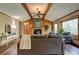 Comfortable living room with a stone fireplace and views of the surrounding trees at 3452 Monica Lane Southwest Sw Ln, Conyers, GA 30094