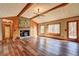 Inviting living room with vaulted ceilings, stone fireplace, and access to the deck at 3452 Monica Lane Southwest Sw Ln, Conyers, GA 30094