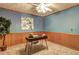 Cozy office space with blue walls, wood trim, a desk, and a potted plant at 3452 Monica Lane Southwest Sw Ln, Conyers, GA 30094