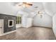 Large bonus room with wood-look floors, vaulted ceilings, and unique windows at 374 Beaumont Farms Dr, Sharpsburg, GA 30277