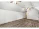 A large, open bonus room space with wood-look floors and neutral decor at 374 Beaumont Farms Dr, Sharpsburg, GA 30277