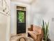Welcoming entryway featuring a wooden bench, tiled floor and coat hooks at 374 Beaumont Farms Dr, Sharpsburg, GA 30277