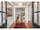 Grand foyer with gleaming hardwood floors, elegant chandelier, and stylish decor, creating a lasting impression at 374 Beaumont Farms Dr, Sharpsburg, GA 30277