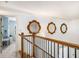 Upper hallway with view of the staircase and a study room at 374 Beaumont Farms Dr, Sharpsburg, GA 30277