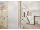 Bright hallway with neutral carpet and access to other rooms at 374 Beaumont Farms Dr, Sharpsburg, GA 30277