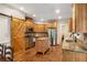 Charming kitchen with stainless steel appliances, granite countertops, and a rustic sliding barn door at 374 Beaumont Farms Dr, Sharpsburg, GA 30277