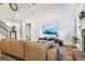 Bright living room boasts a high ceiling, fireplace, and comfortable leather sofa at 374 Beaumont Farms Dr, Sharpsburg, GA 30277