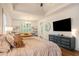 Spacious main bedroom with tray ceilings, chandelier and seating area at 374 Beaumont Farms Dr, Sharpsburg, GA 30277