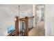 Staircase with wood and metal railing leading to an upper level at 374 Beaumont Farms Dr, Sharpsburg, GA 30277