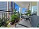Cozy balcony seating area with potted plants and cityscape views at 620 Peachtree Ne St # 1111, Atlanta, GA 30308