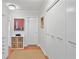 Hallway with large closets and a white door at 620 Peachtree Ne St # 1111, Atlanta, GA 30308