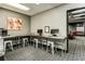 Shared work room offers desk space, stools and computers, with access to a separate lounge area at 620 Peachtree Ne St # 1111, Atlanta, GA 30308